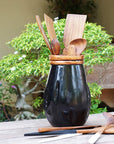 Sam Black Teak Vase with Copper Leaf Accent